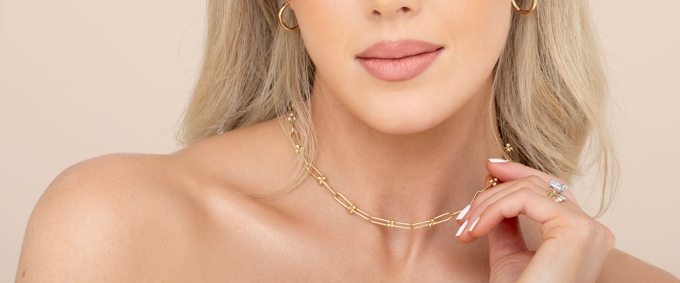 Model wearing a gold layering chain | Gear Jewellers Dublin
