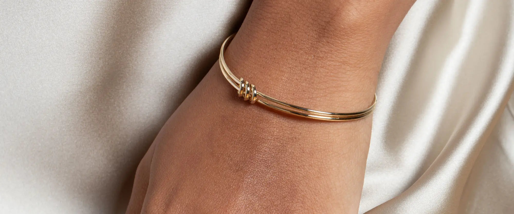 Woman wearing a Gold Bangle | Gear Jewellers Dublin