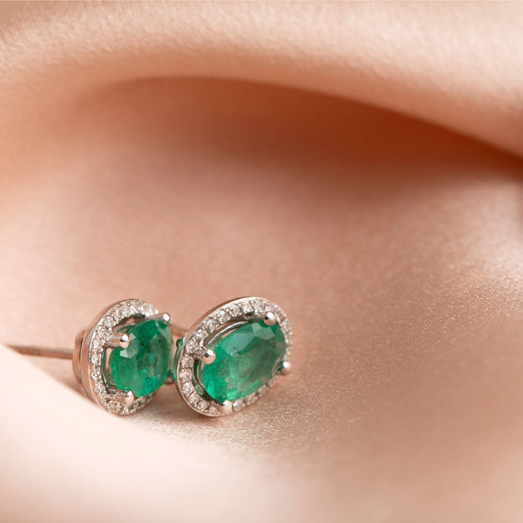 emerald dia earrings on fabric