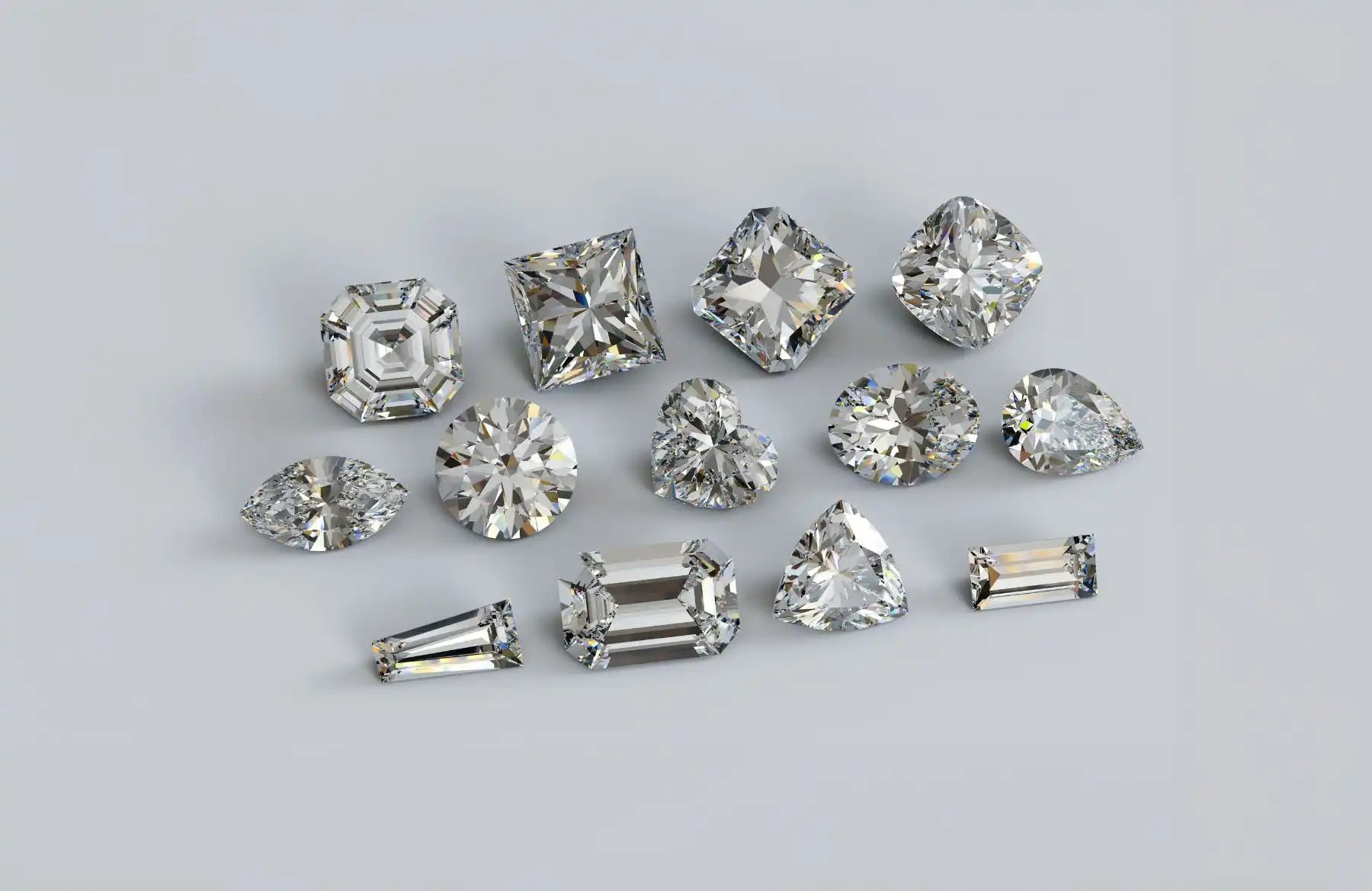 Collection of loose diamonds in various cuts including princess, round, and baguette shapes.
