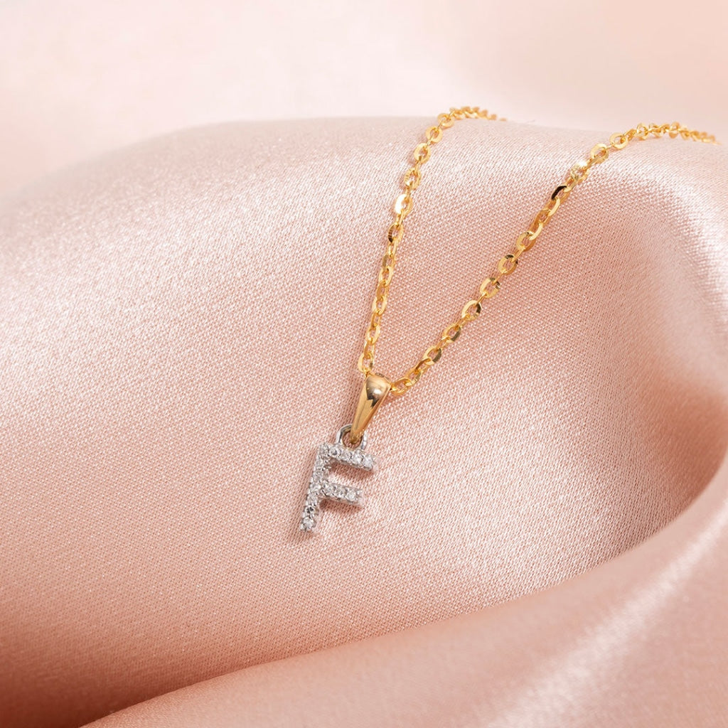 Diamond initial necklace on a gold chain