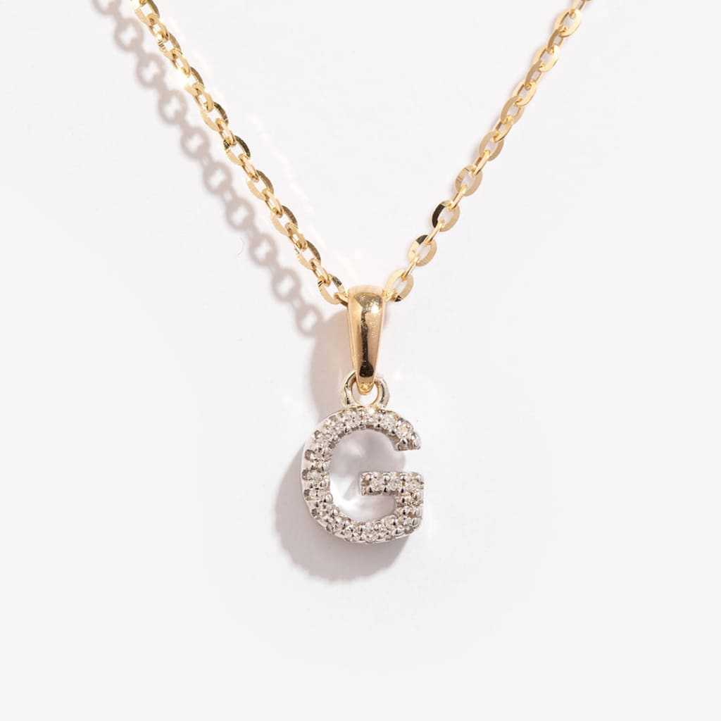9ct gold initial necklace with diamonds on a gold chain