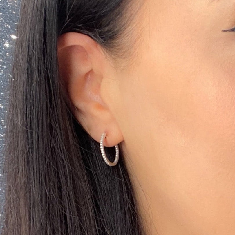 diamond hoop earring on model