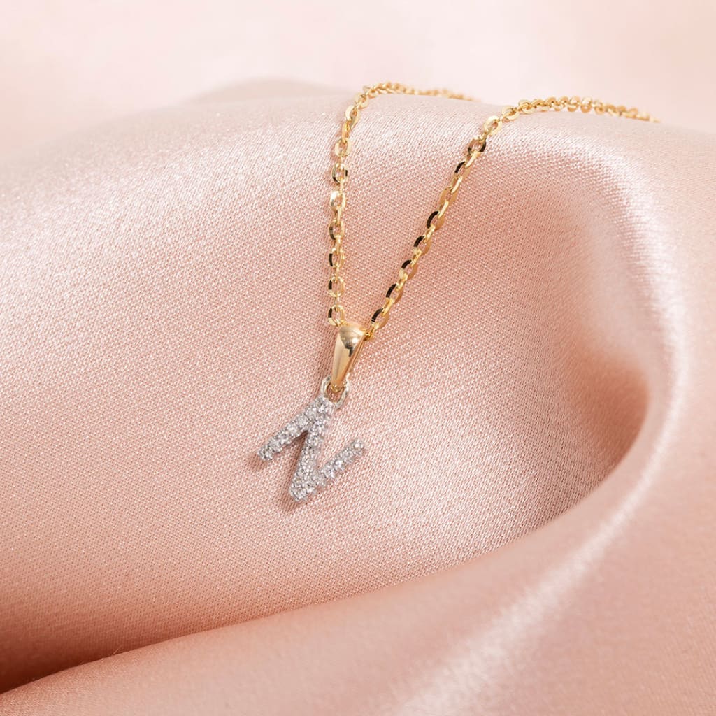 Mini diamond initial on a gold chain N