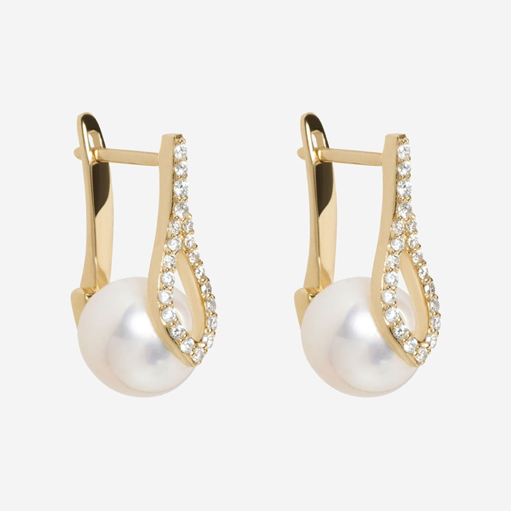 Pearl diamond earrings side view on white background