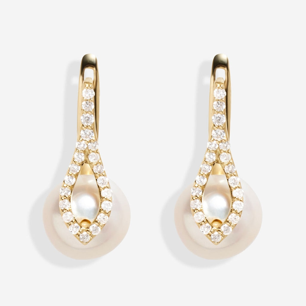 Product image of pearl and diamond earrings on white background