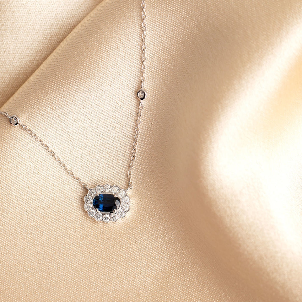 sapphire diamond necklace on fabric