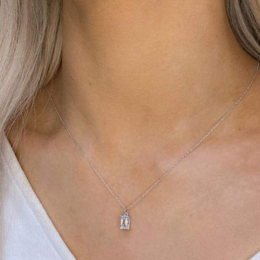 woman wearing sterling silver emerald cut necklace 