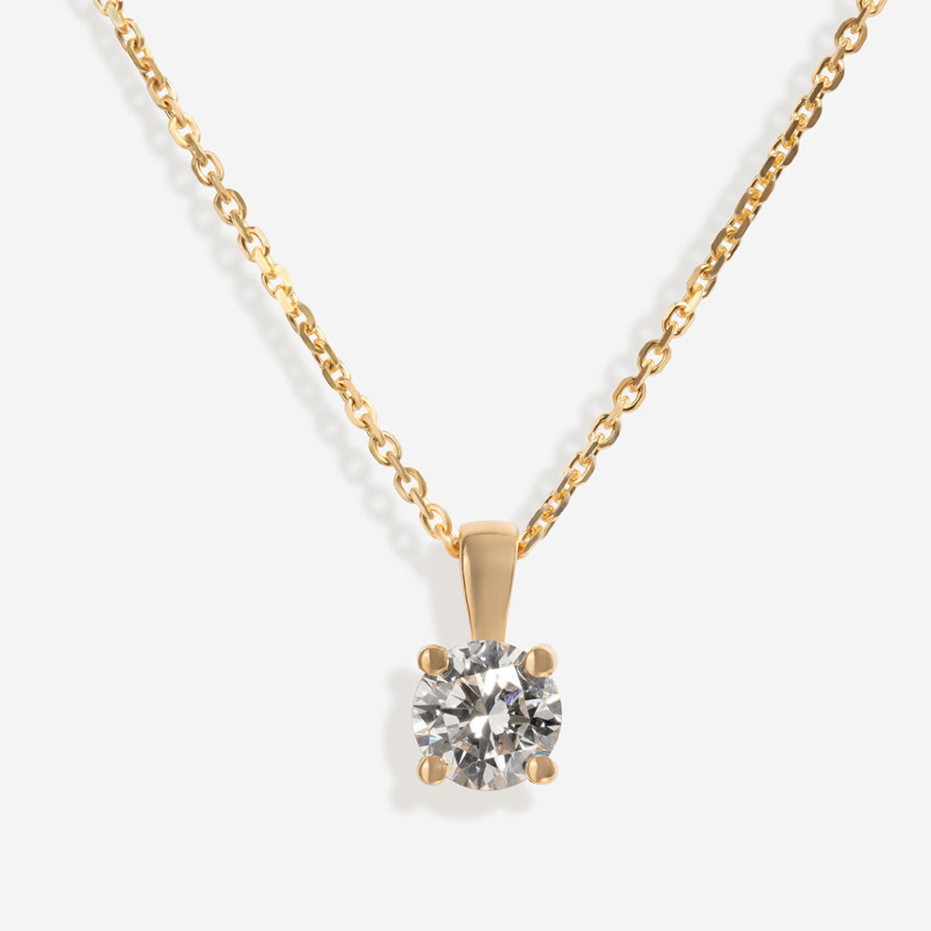 close up of yellow gold diamond necklace