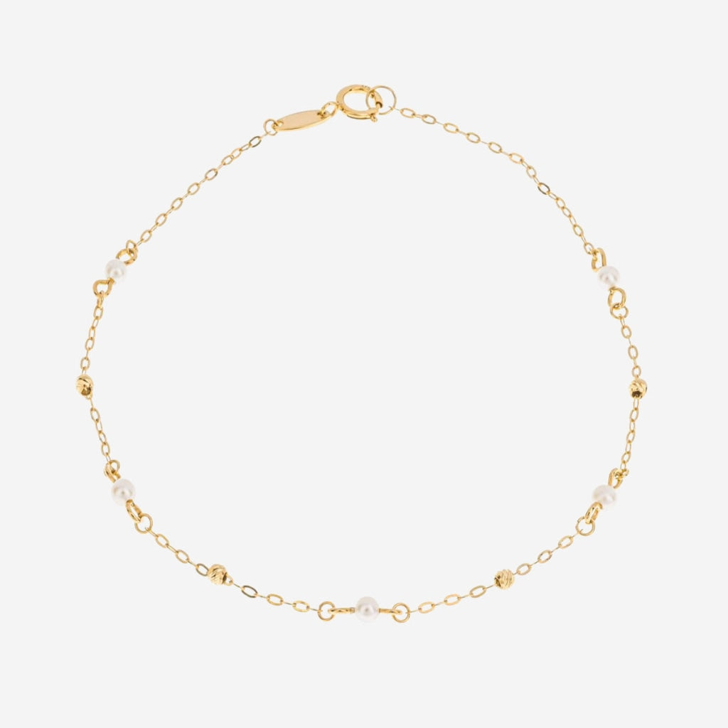 Hints of pearl bracelet on white background