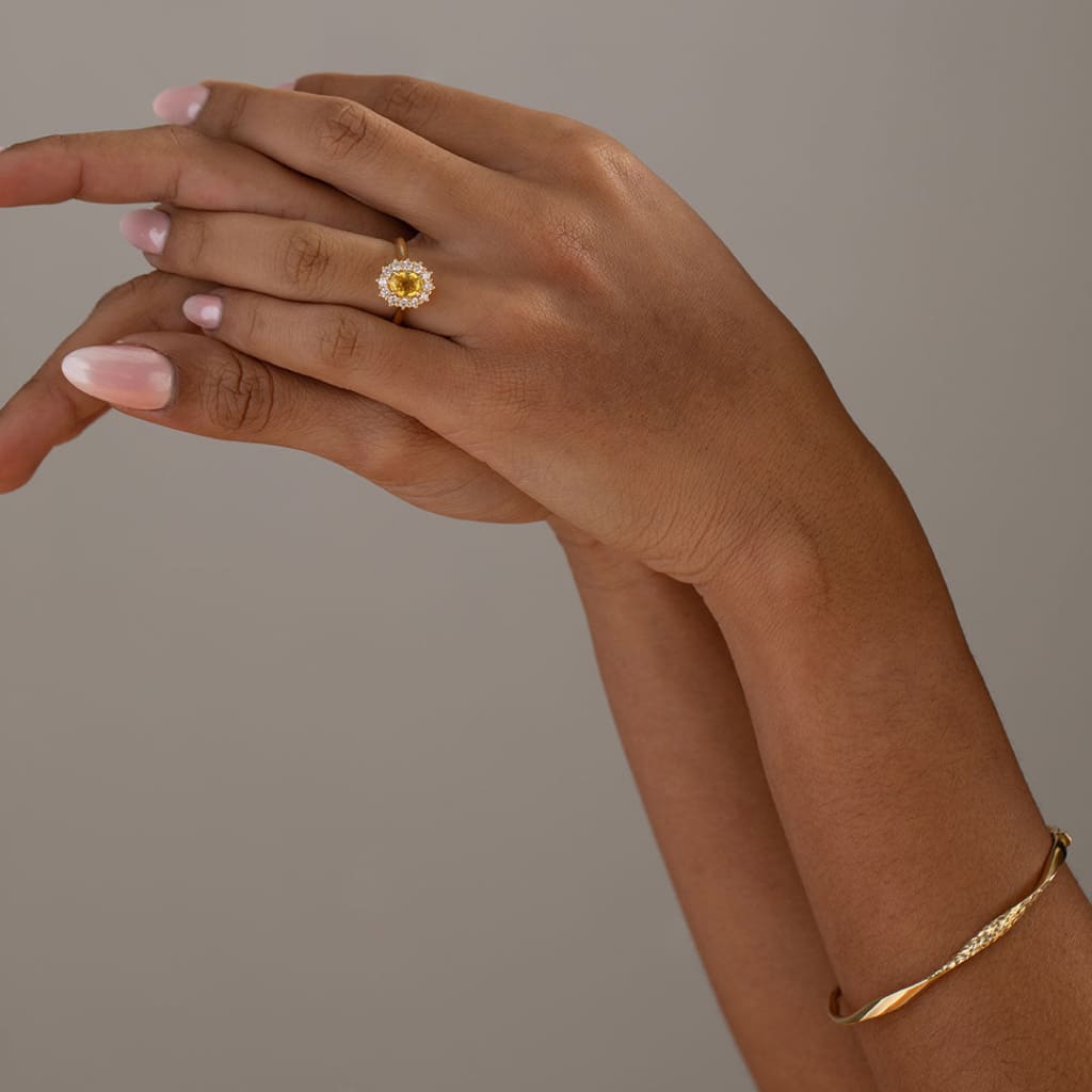 yellow sapphire engagement ring on models hand