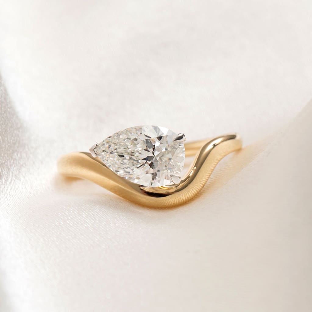 sideways pear cut engagement ring