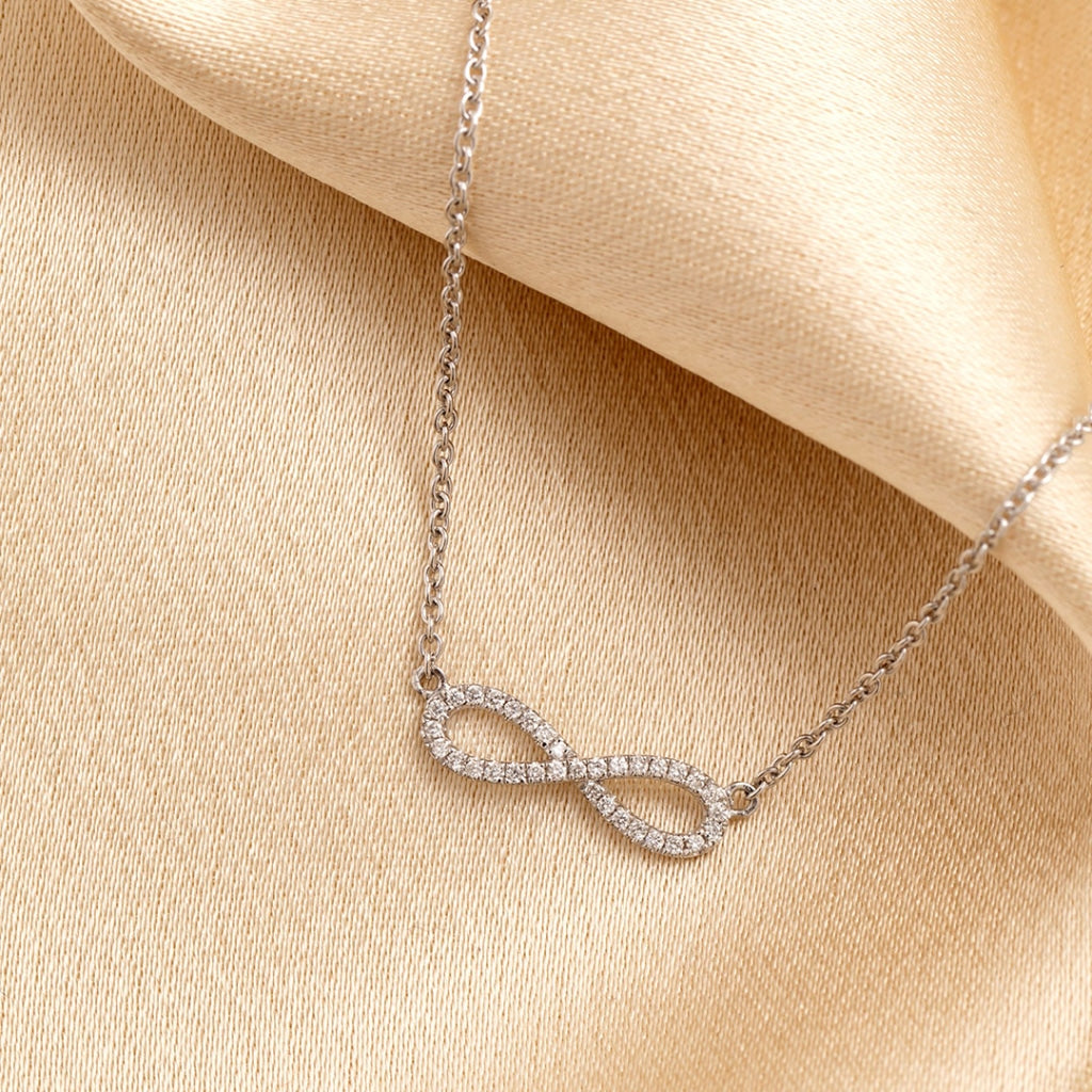 Infinity Diamond Necklace on fabric