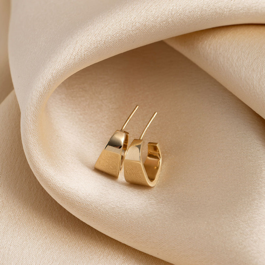 gold hoop earrings stem close up