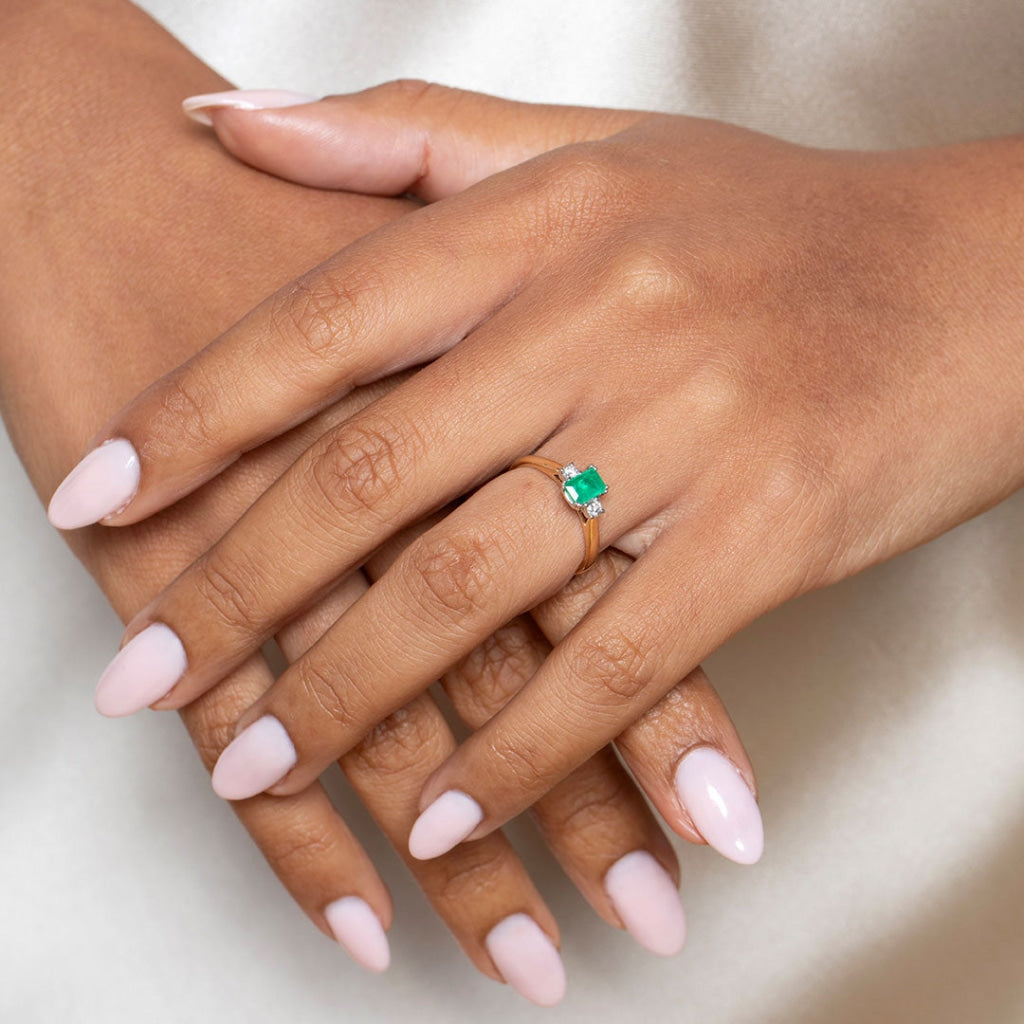 Lady wearing Emerald Diamond ring