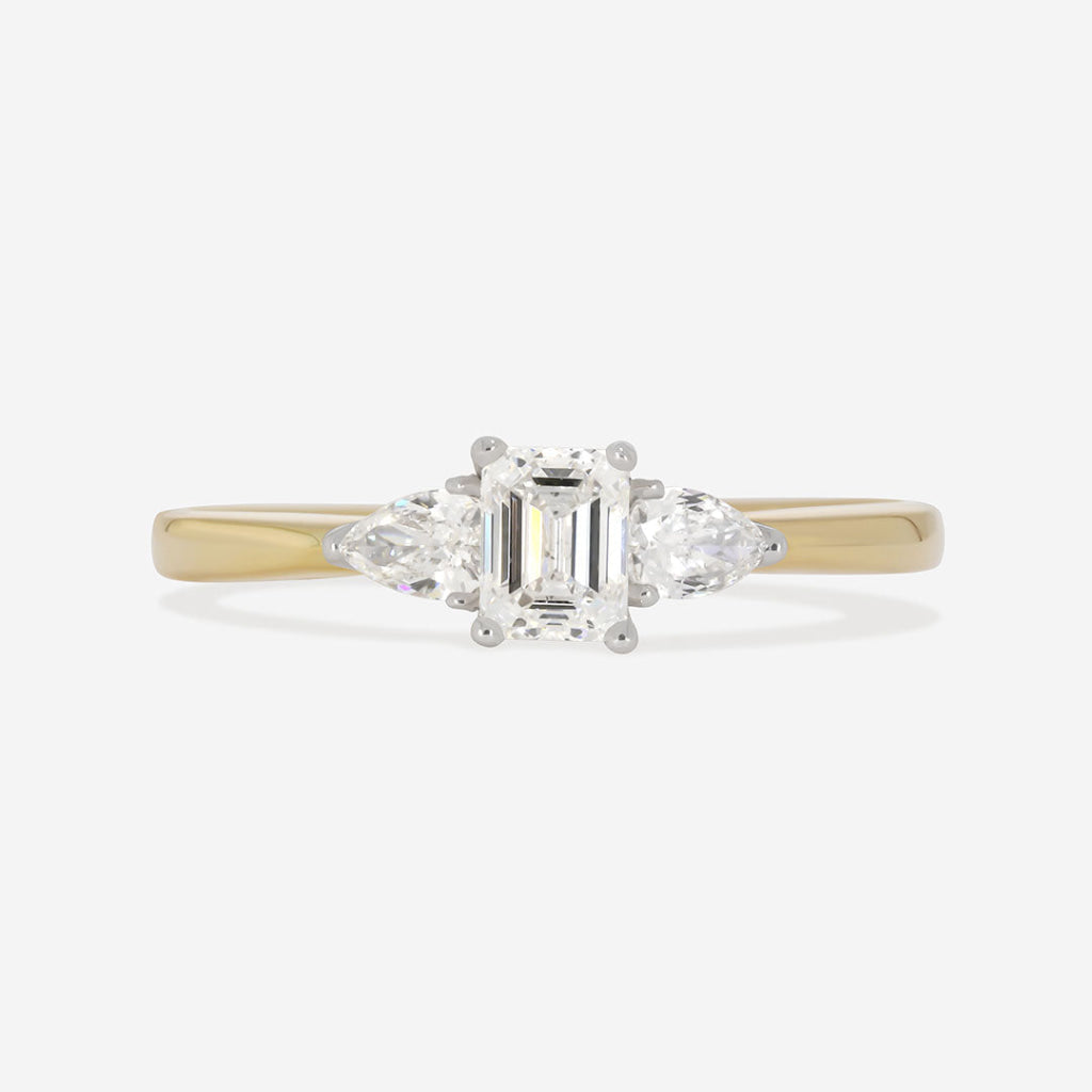 three stone diamond engagement ring on white background