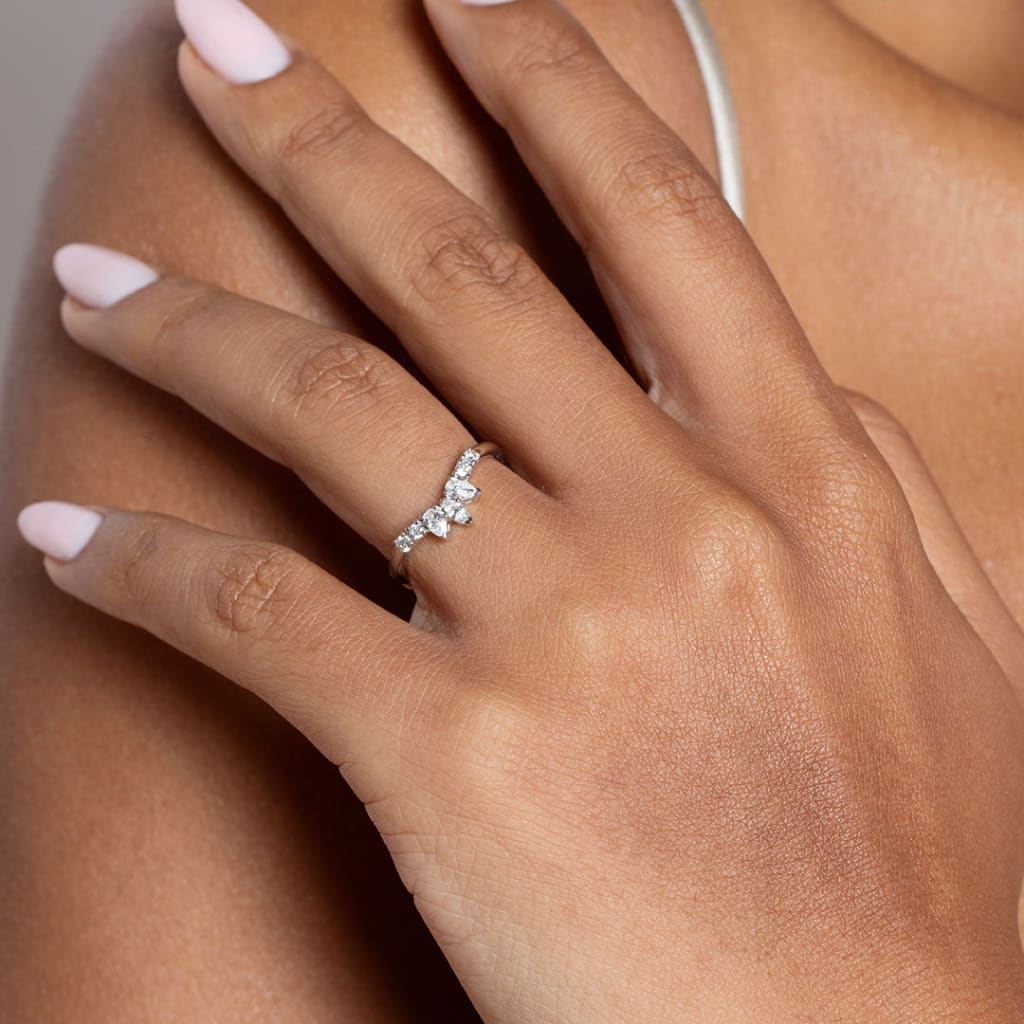 Shaped diamond wedding band on hand model