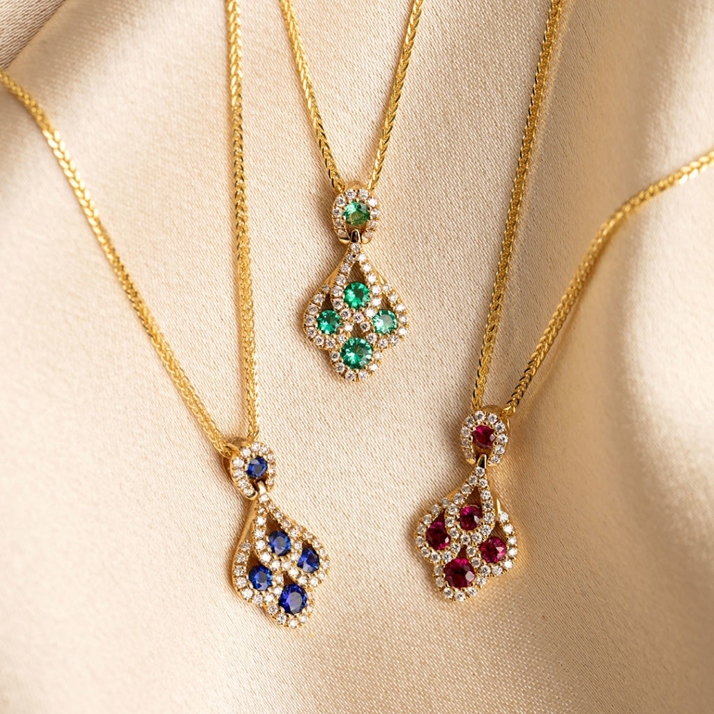 A trio of the Peacock Necklace Collection in Emerald, Ruby & Sapphire