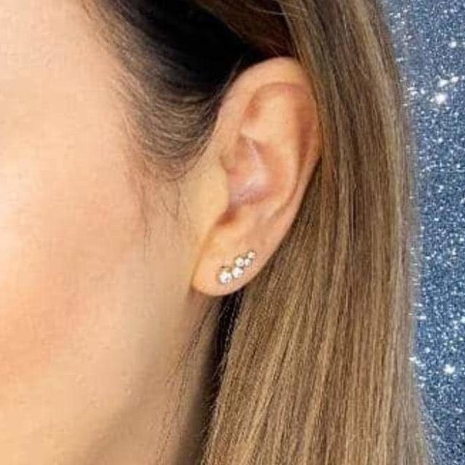 Woman wearing 9ct gold Raindrops Earrings | Gear Jewellers Dublin