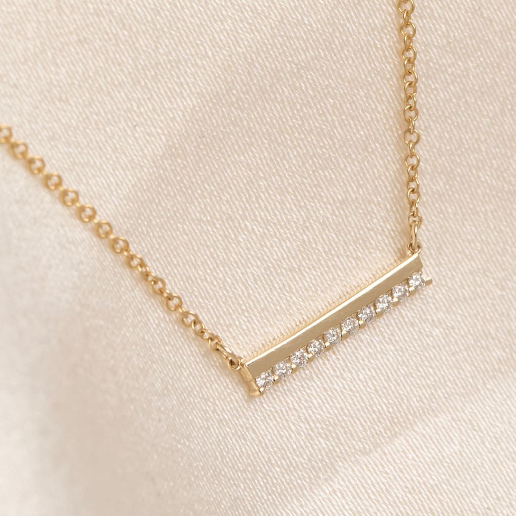 yellow gold diamond set bar necklace