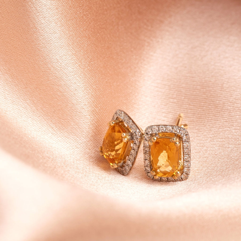 Citrine and diamond earrings on fabric
