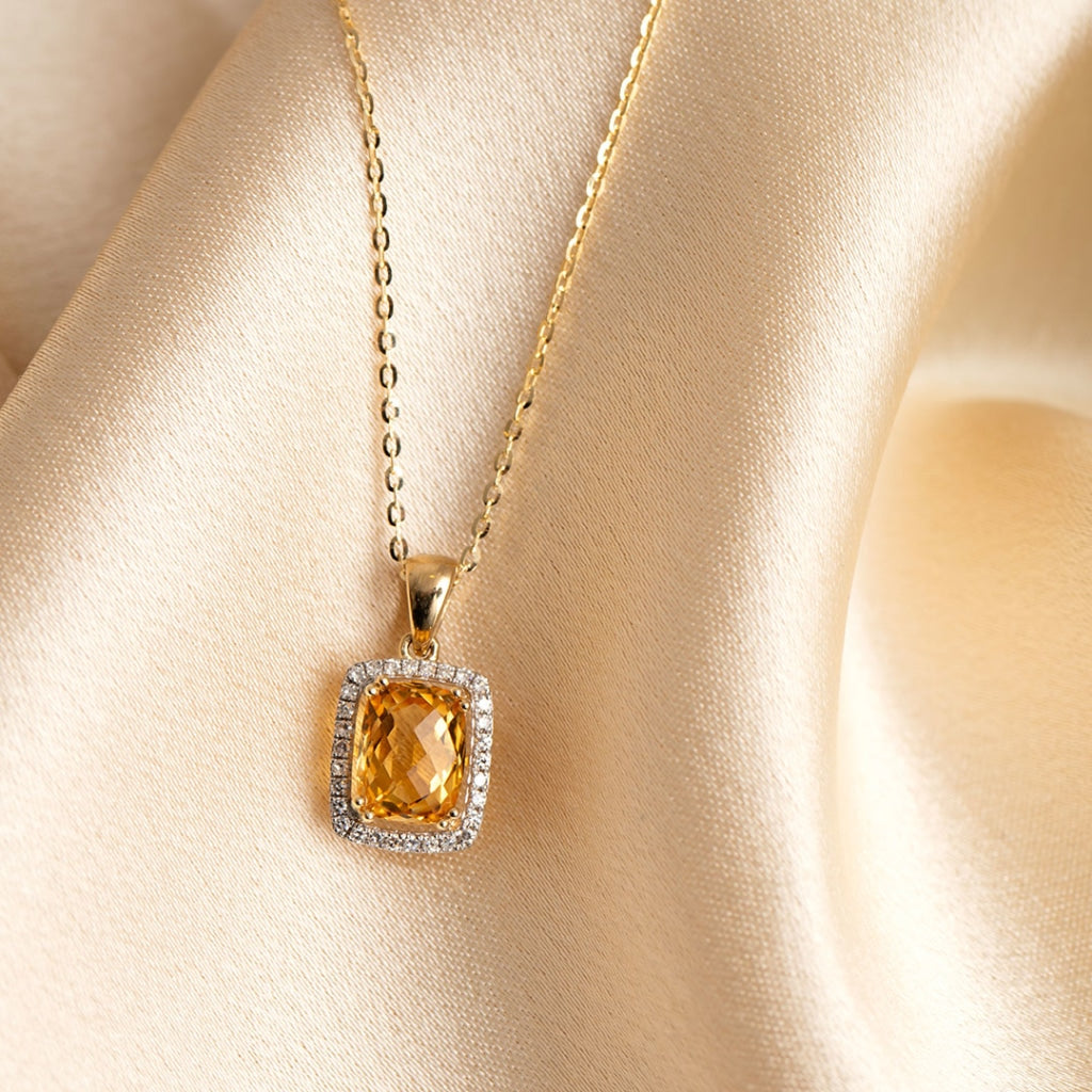 citrine and diamond necklace on fabric