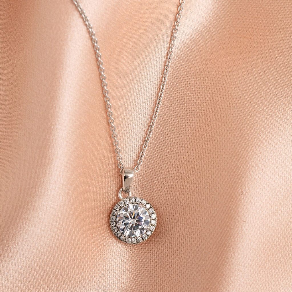 woman wearing sterling silver round necklace