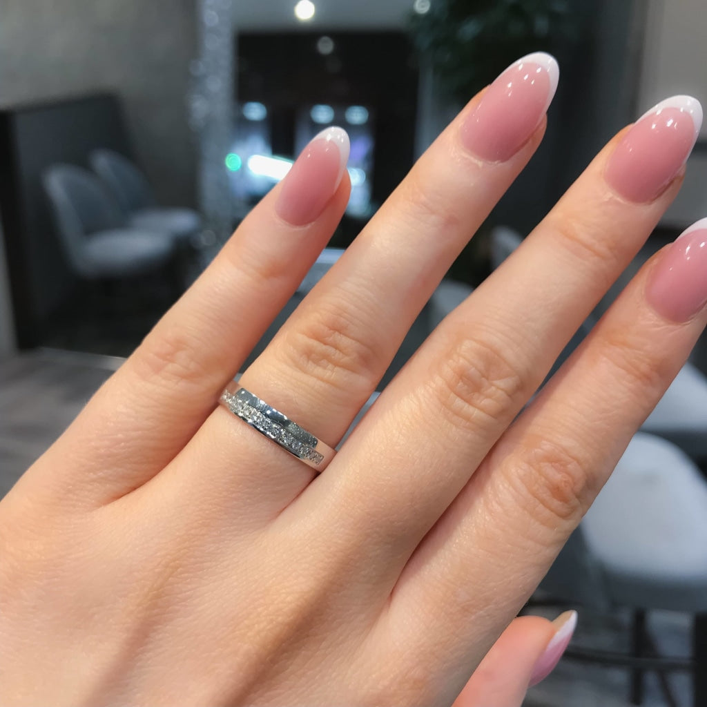 Diamond Wedding Ring on woman's hand.