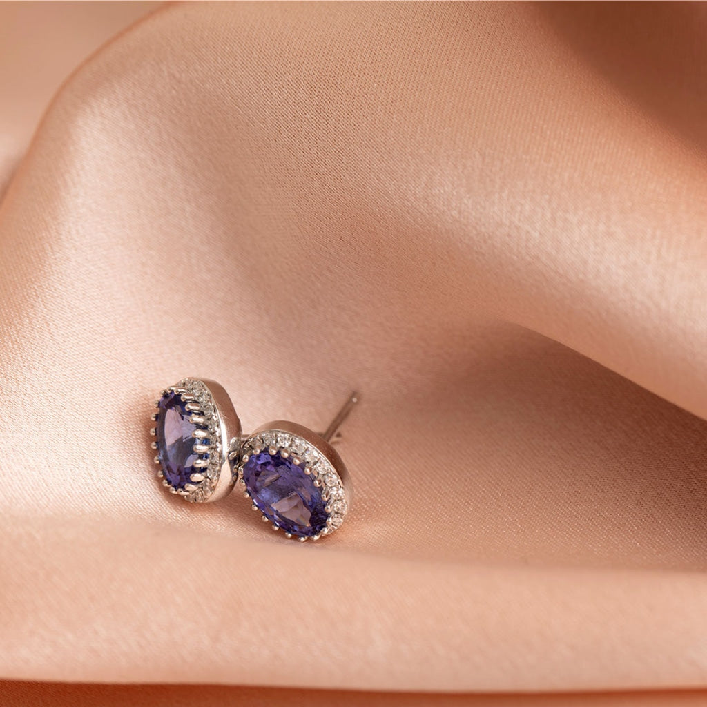 tanzanite diamond earrings on fabric