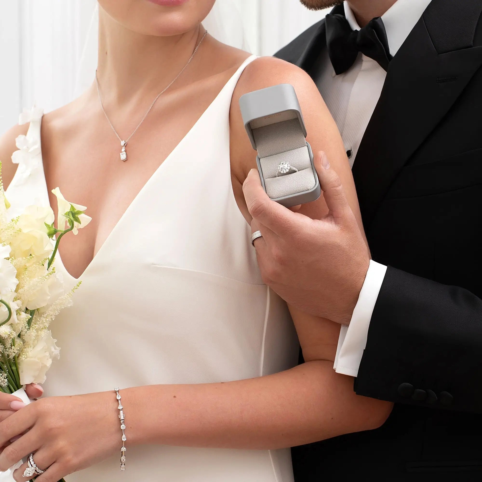 A man showing an engagement ring 