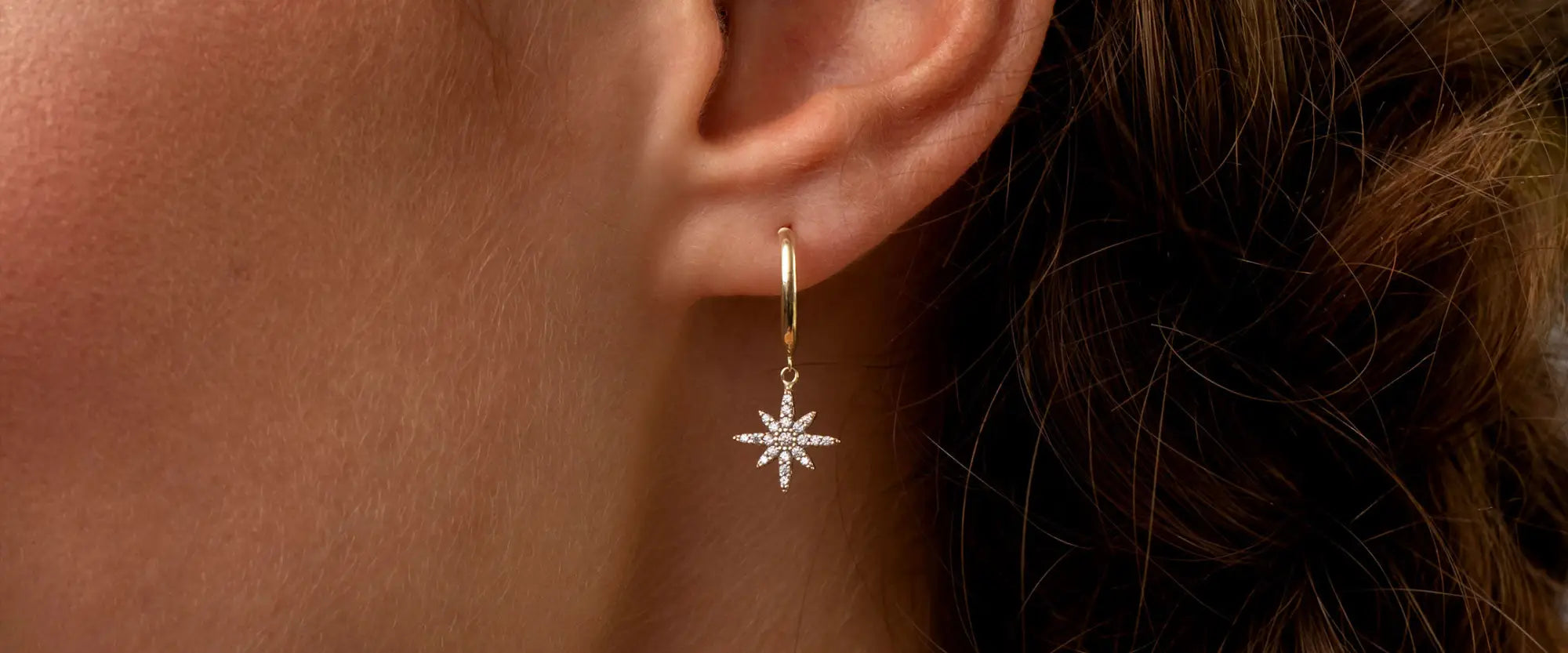 Woman wearing drop earrings | Gear Jewellers Dublin