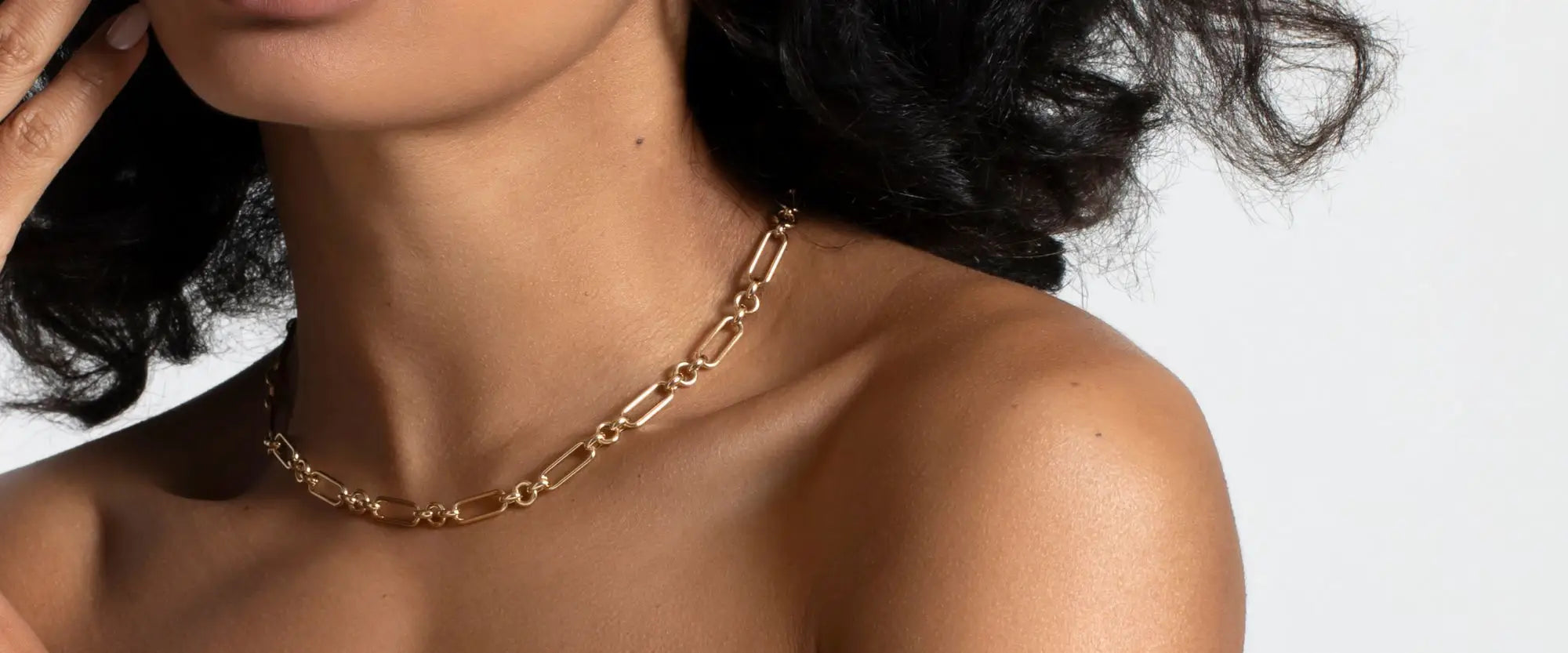 Model wearing a gold layering chain | Gear Jewellers Dublin