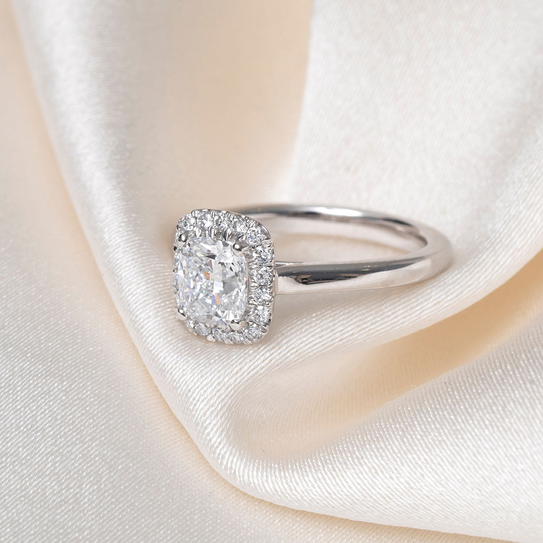 Cushion halo lab grown diamond engagement ring.