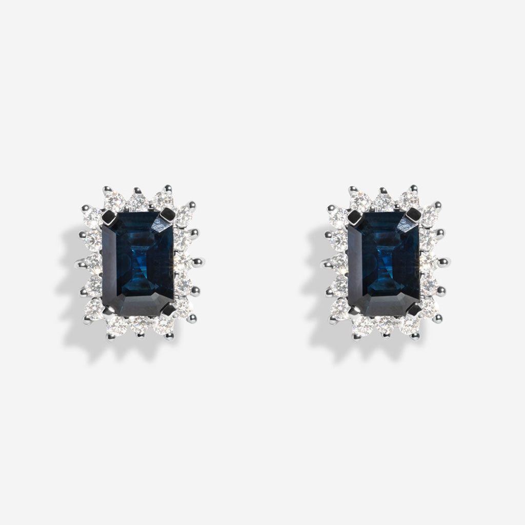 adorn sapphire earrings on white background