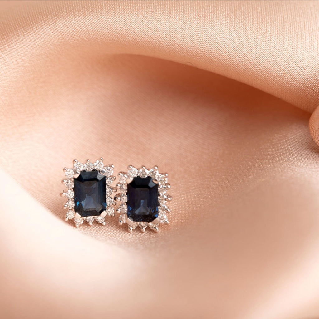 adorn sapphire earrings on fabric
