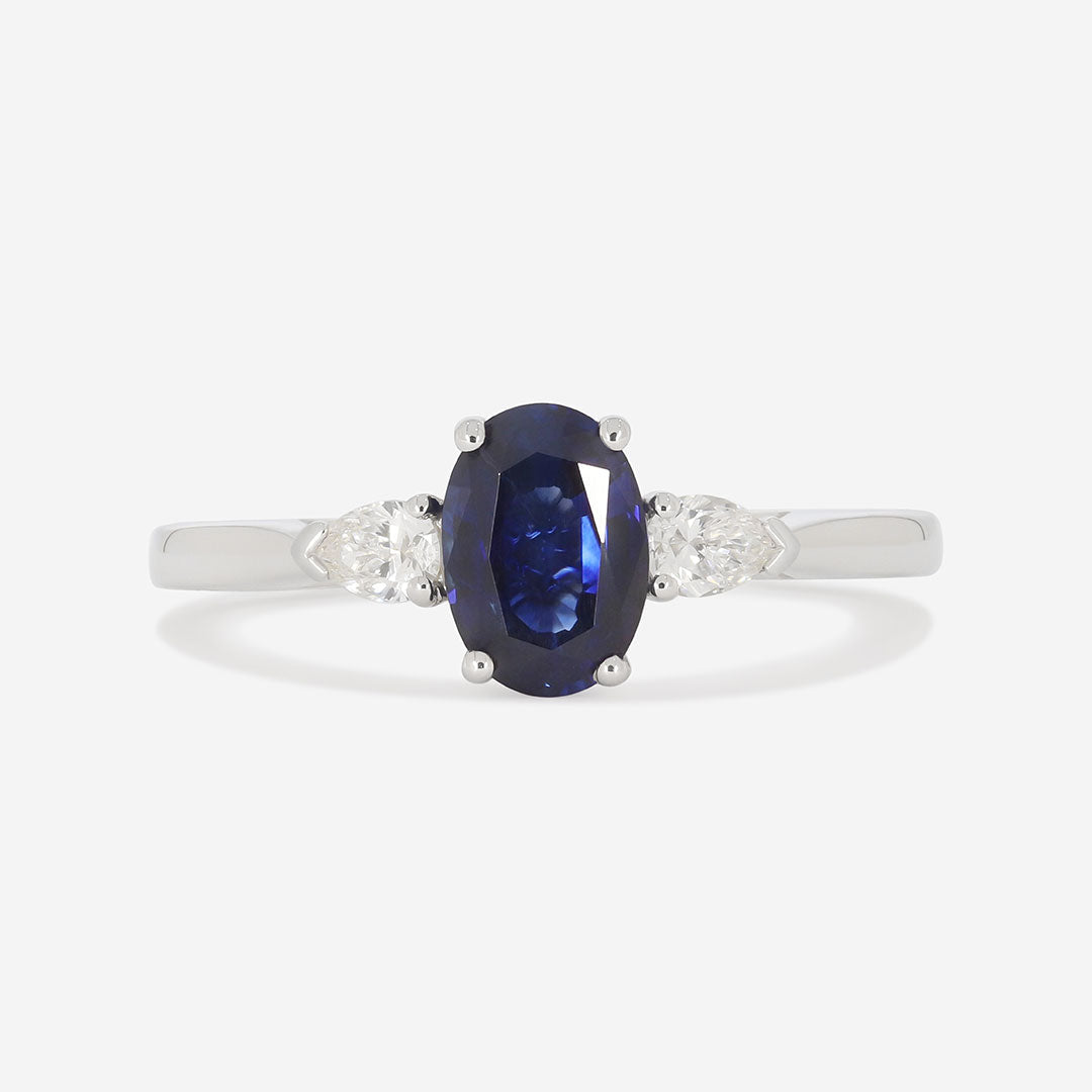 sapphire with pear side diamonds on white background