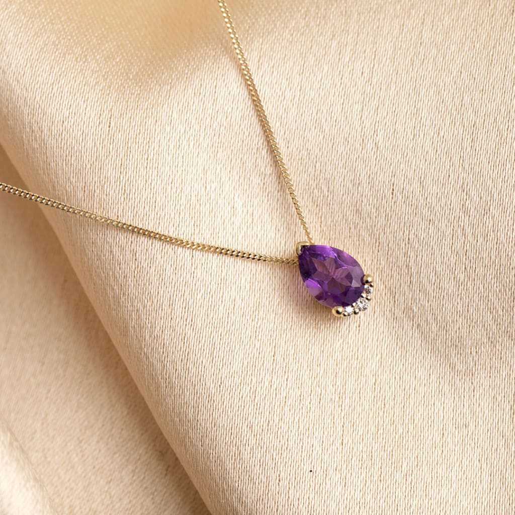 Gold necklace with purple stone discount