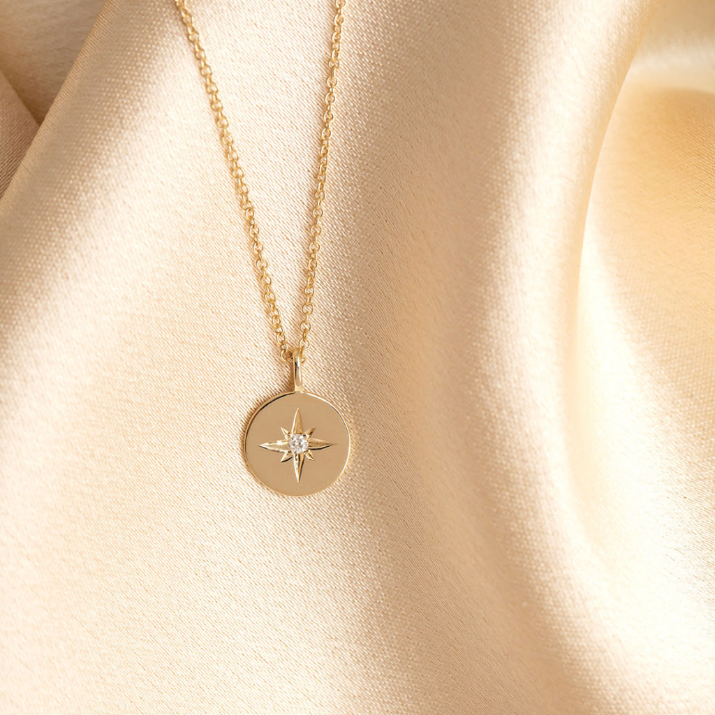 Aster circle gold necklace on fabric