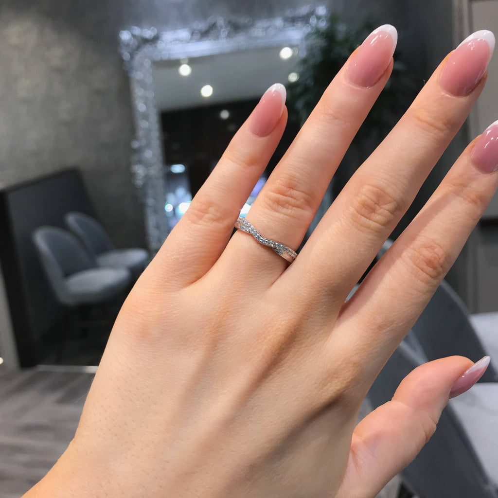 Diamond Wedding Ring on a woman's hand.