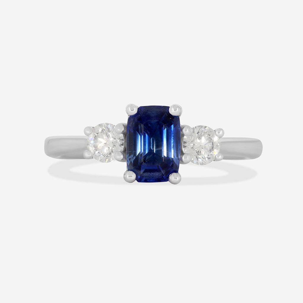 emerald cut sapphire three stone engagement ring