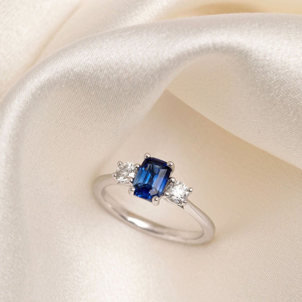 emerald cut sapphire three stone ring