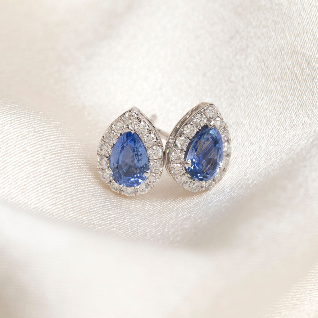 sapphire and diamond earrings on fabric