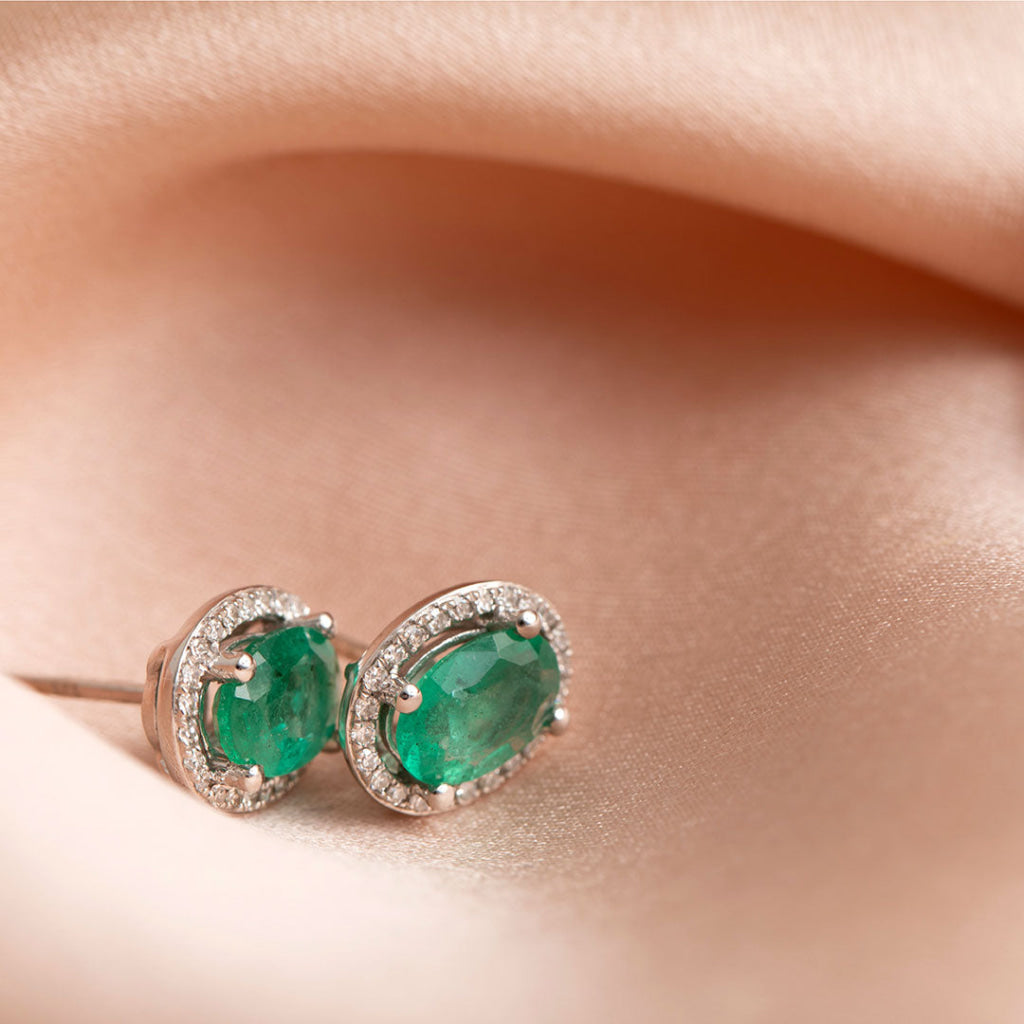 emerald dia earrings on fabric