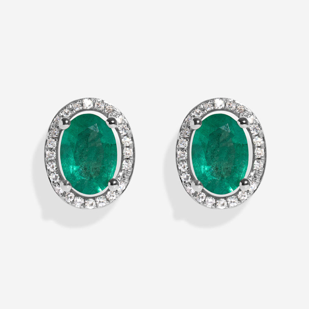 emerald dia earrings on white background