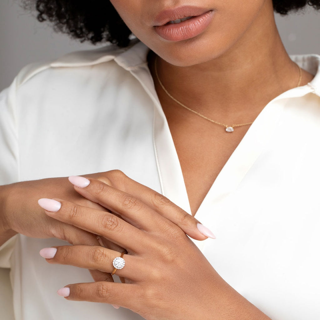 Model wearing Blanca gold round engagement ring