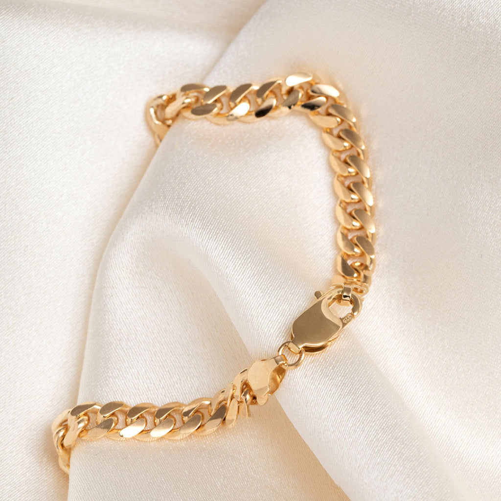 side view of gold curb bracelet