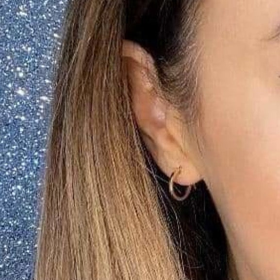 Woman wearing 9ct gold Plain Hoop Earrings 15mm | Gear Jewellers Dublin