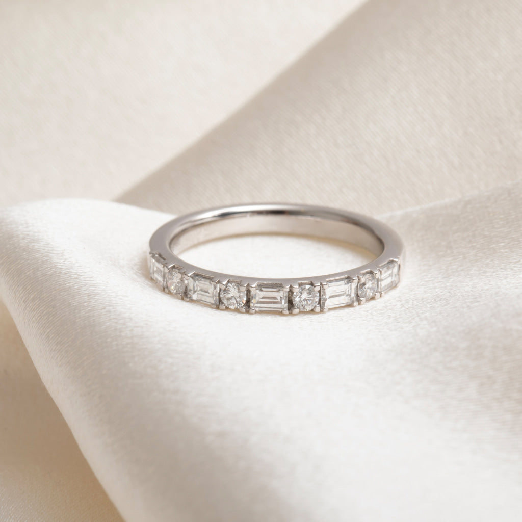 platinum wedding ring on fabric