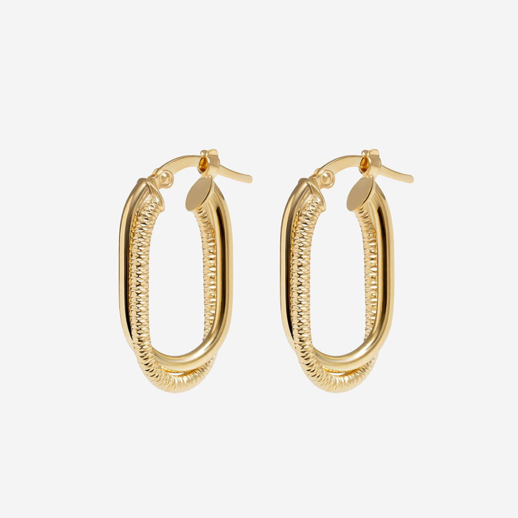 textured hoop earrings on white background