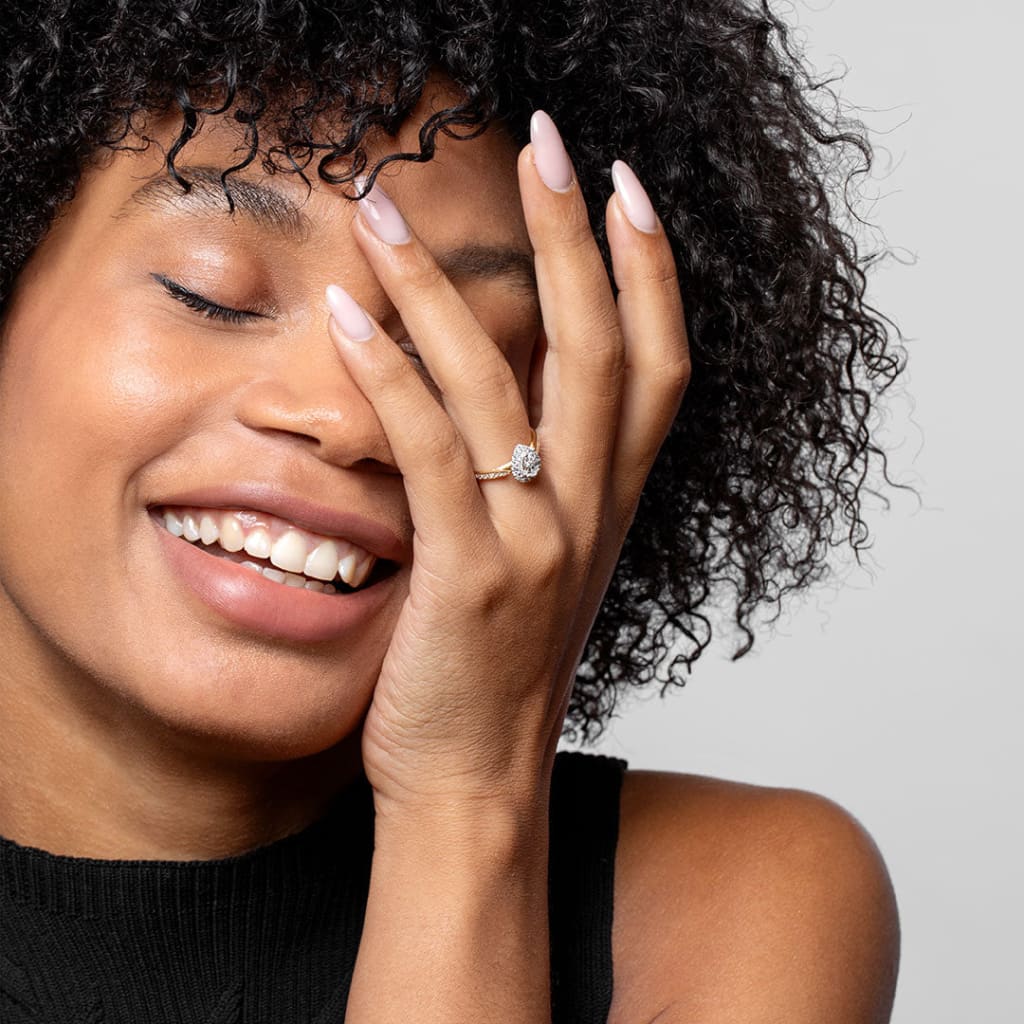 Smiling model wearing Caitriona Diamond Engagement Ring